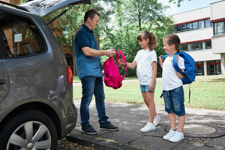 dad-gathers-children-school-helps-put-backpack-his-daughter-back-school